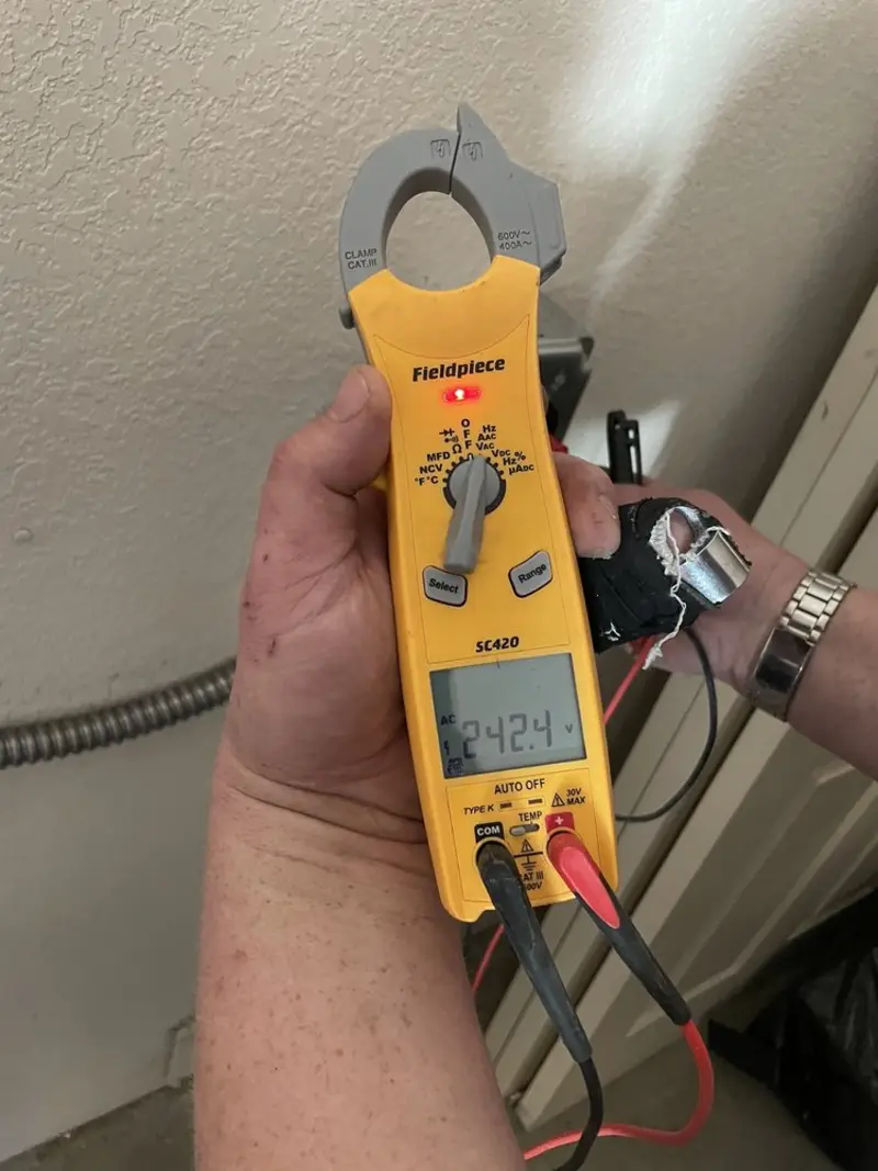 Voltage testing with clamp meter during Aluminum Wiring Replacement in Bowleys Quarters
